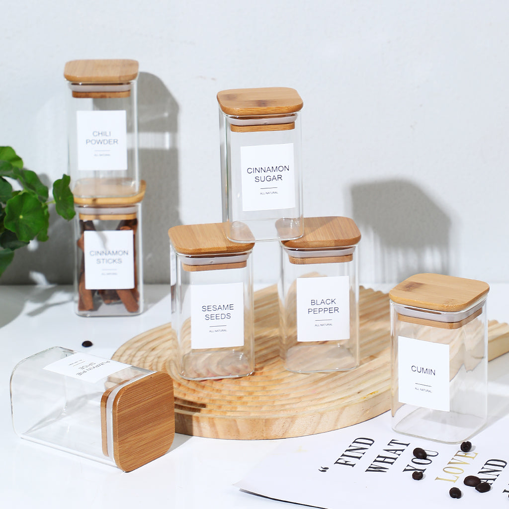 Glass spice storage jars with kitchen labels